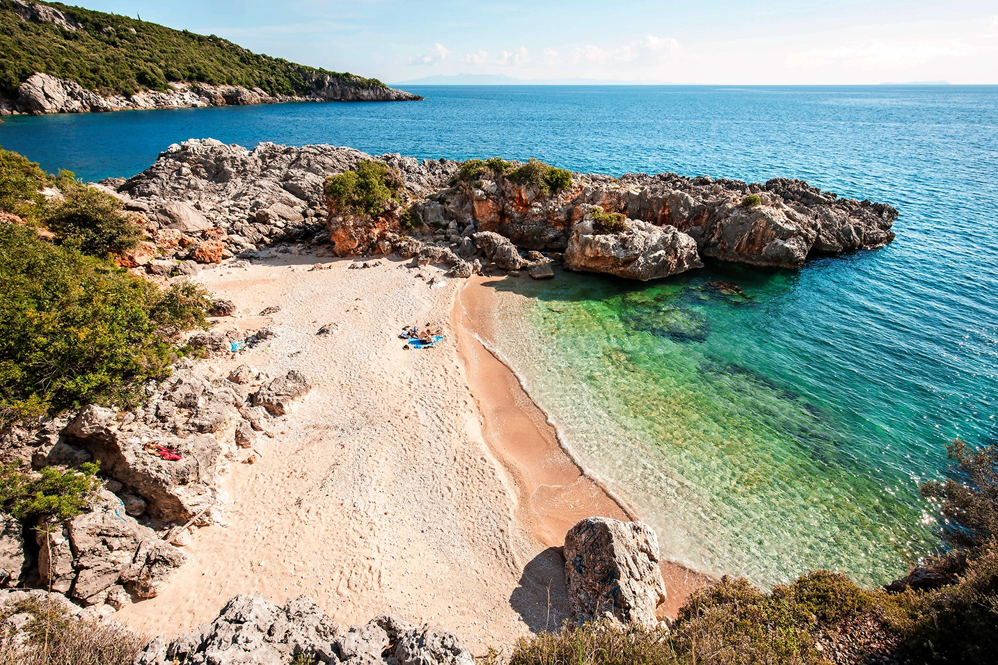 The Aquarium Beach is a small, secluded pebble beach with crystal clear water in a small cove among the rocks.