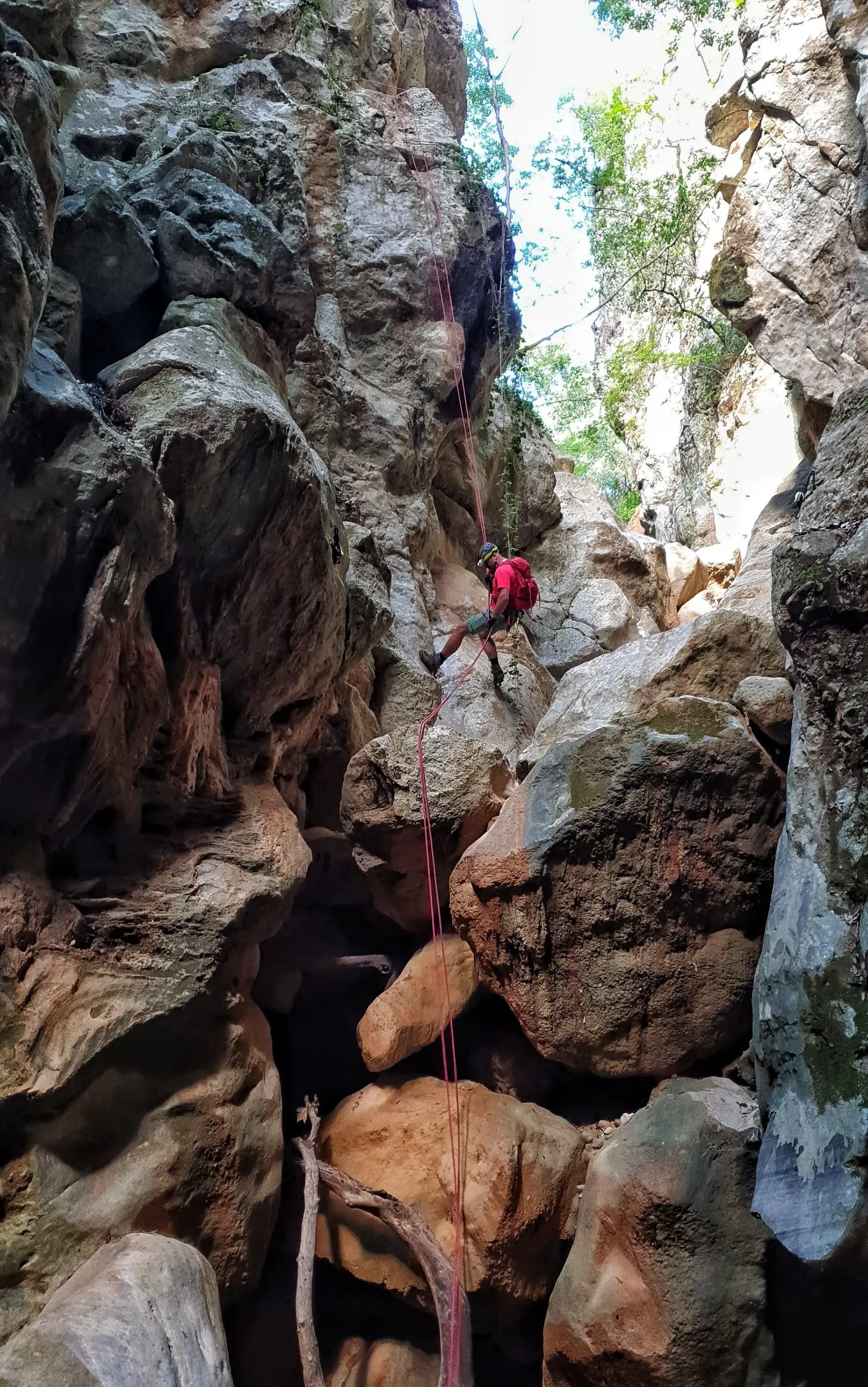 Climbing the canyon of Gjipe.