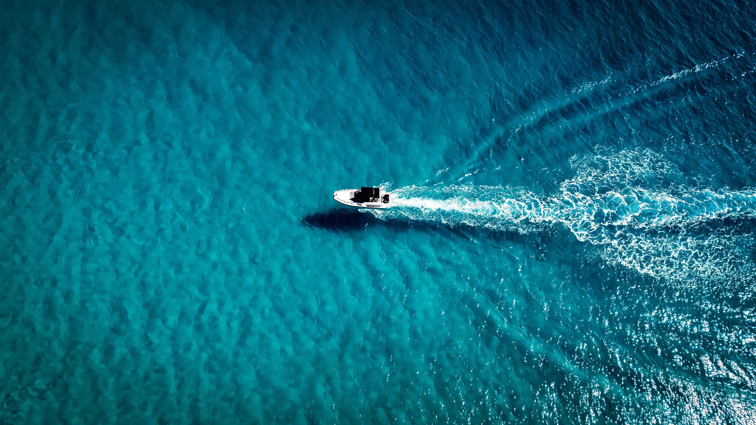 Speed boat criising along the coast of Himara.